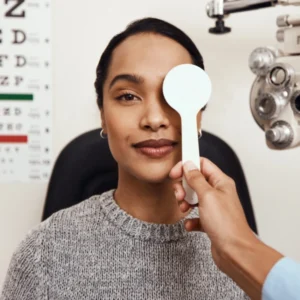 Woman getting her eyes examined at the optometrist.