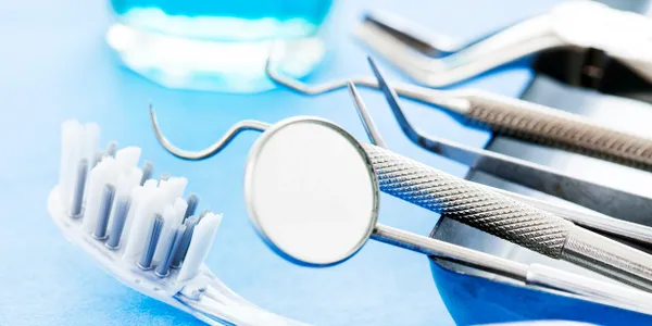 A close up of dental instruments on a table