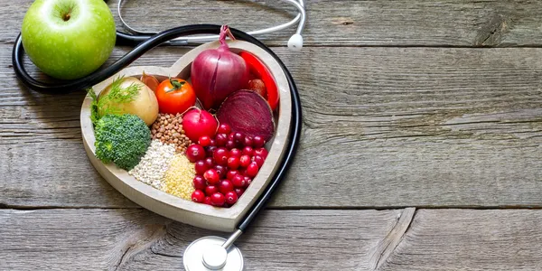 A stethoscope sitting on top of a wooden table.